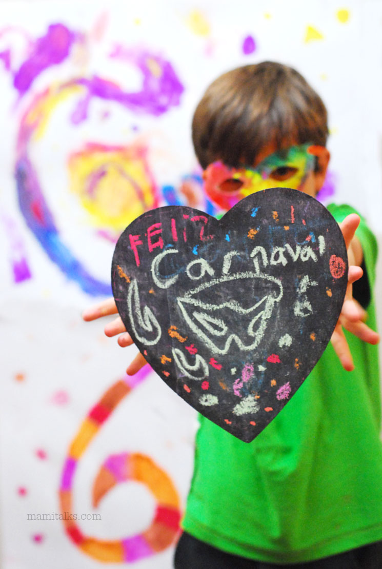 Crafty Carnaval celebration, boy holding a heart shaped chalkboard. -MamiTalks.com