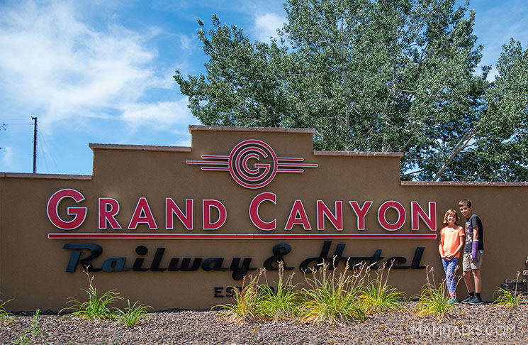 Grand Canyon railway and hotel with kids posing in front. -MamiTalks.com