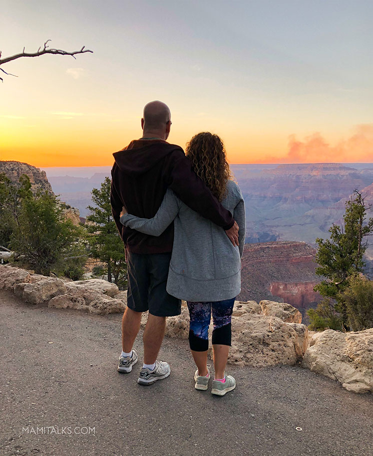 Sunset view, couple looking at sunset Grand Canyon. -MamiTalks.com