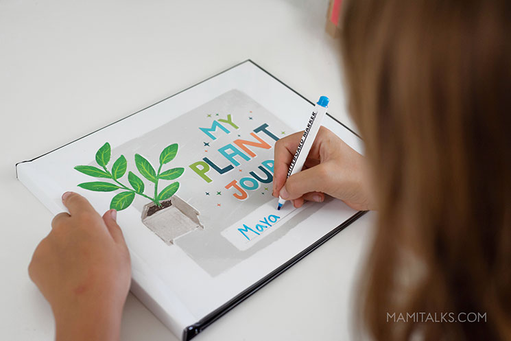 Girl filling out her plant journal. MamiTalks.com